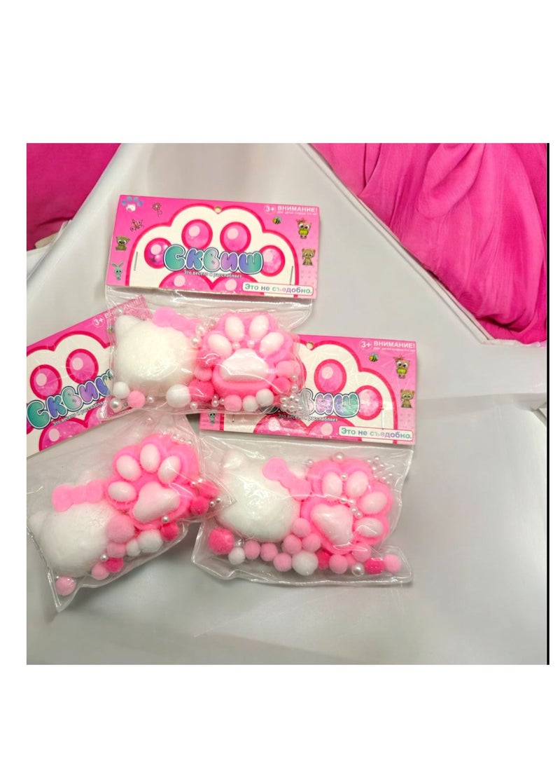 Squishy Cat Claw The squishy features a cute and fun cat claw design. Colors: It features matching white and pink colors, adding a fun and exciting element. Texture: It's made of a soft, squeezable material, making it fun to touch and play with.