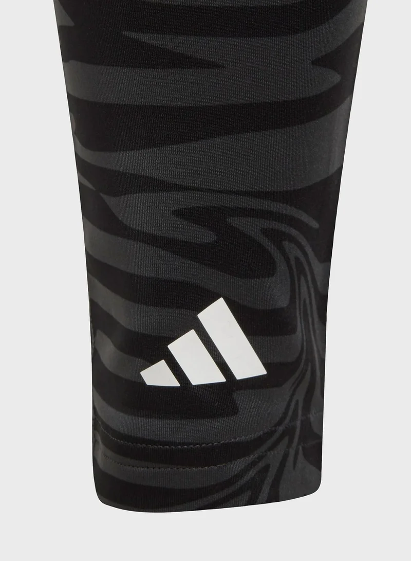 adidas بنطال ضيق آيروريدي أوبتيم 7/8 مطبوع بالكامل بخصر مرتفع وجيوب للأطفال
