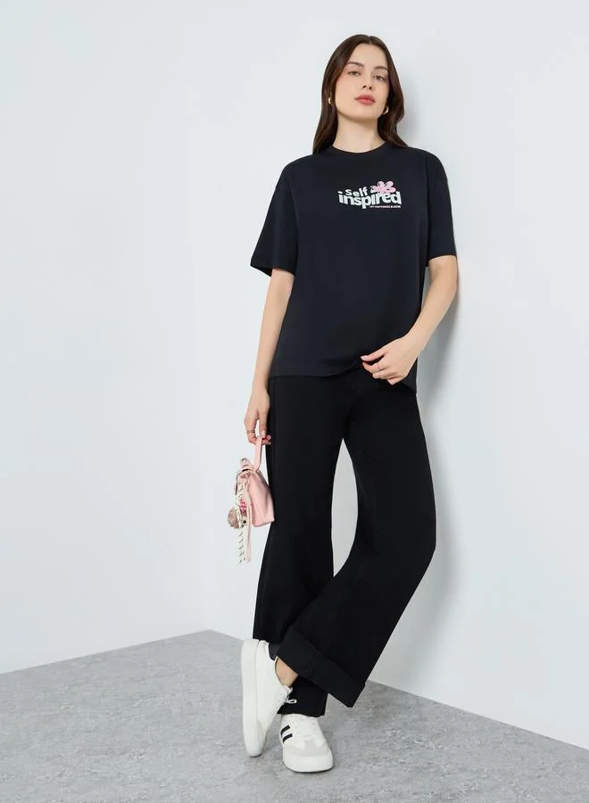 Styli Women Black Oversized Graphic Print T-Shirt