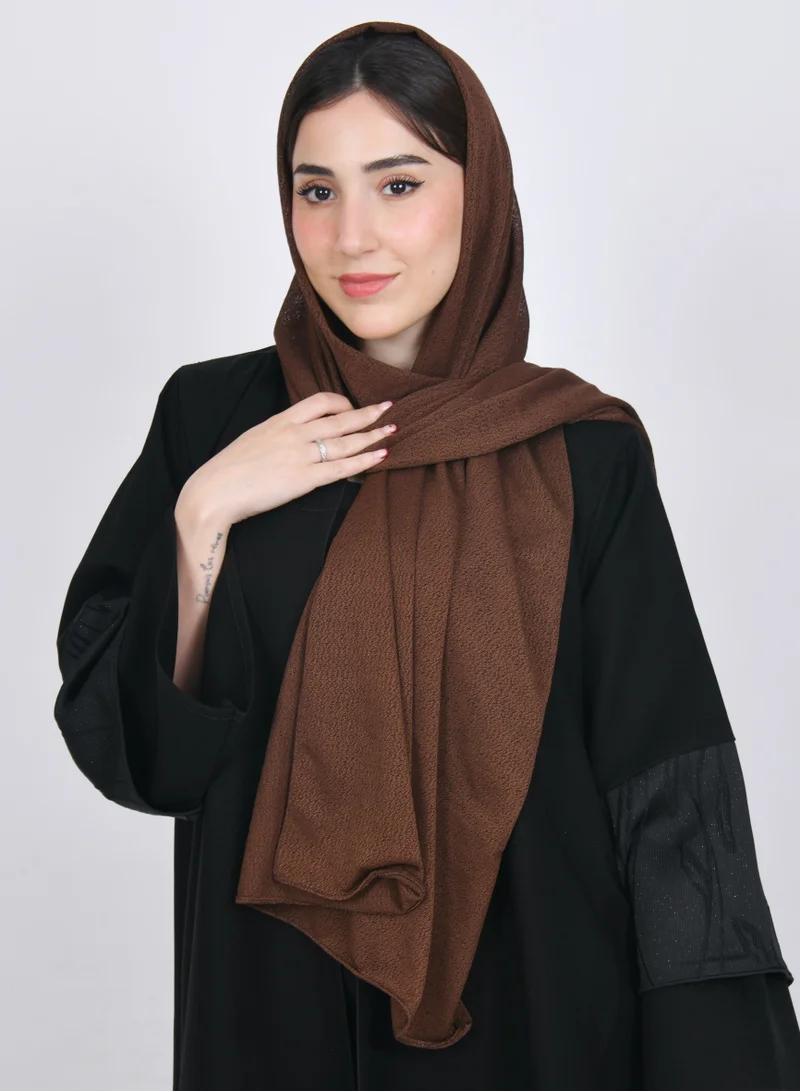 HAWRAA ABAYA A bright brown gauze veil