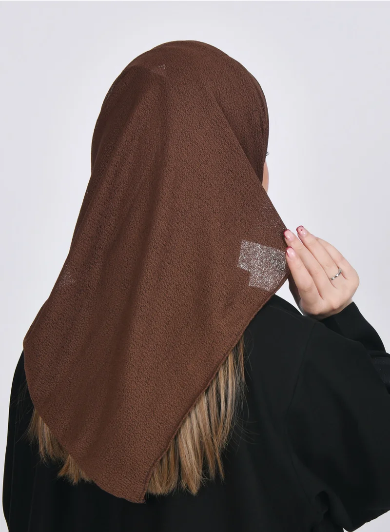 HAWRAA ABAYA A bright brown gauze veil