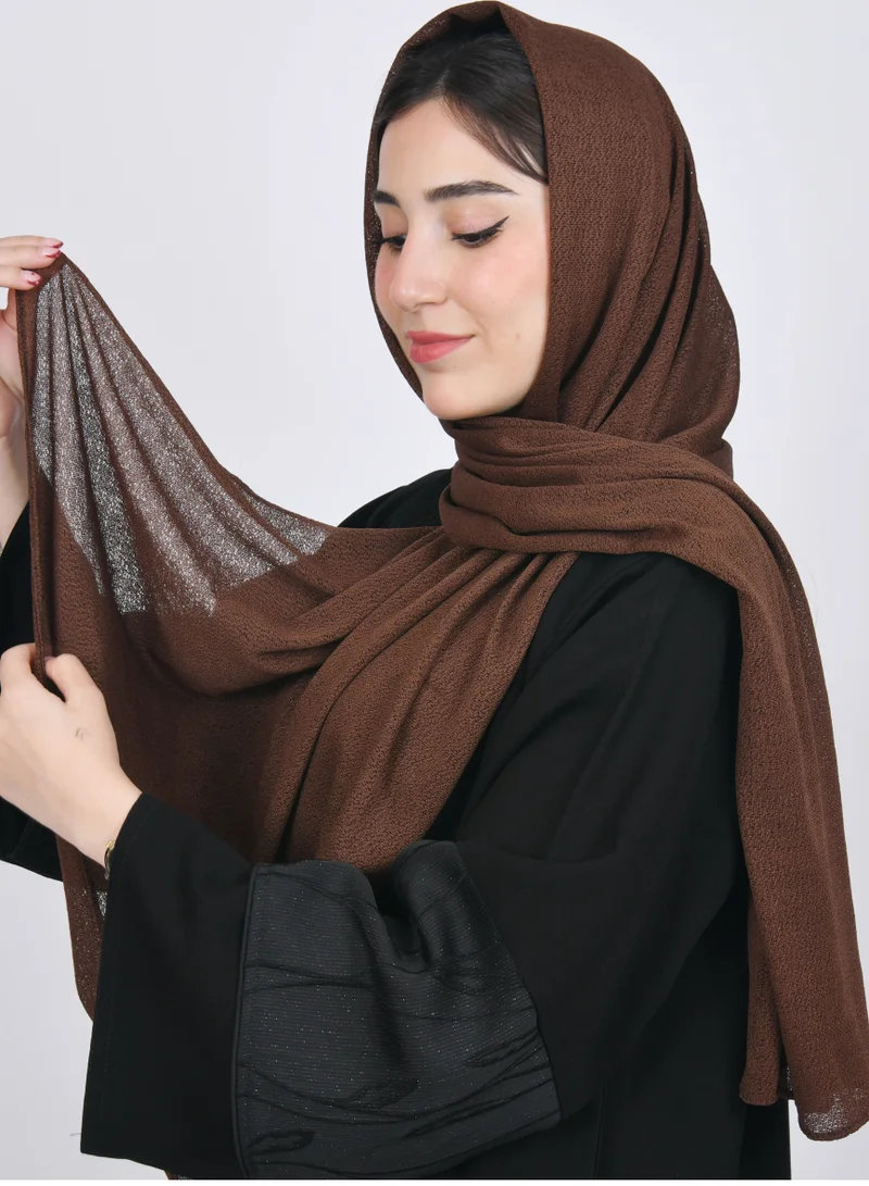 HAWRAA ABAYA A bright brown gauze veil