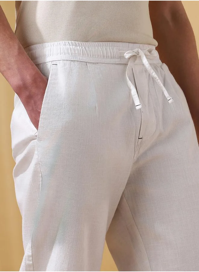دينيس لينغو White 100% Cotton Slub Solid Pattern Straight Fit Trouser for Men Full Bottom Body Wear Pleat Front Drawstring Closure Woven Weave Mid Rise Waist - Perfect for Lifestyle Occasions
