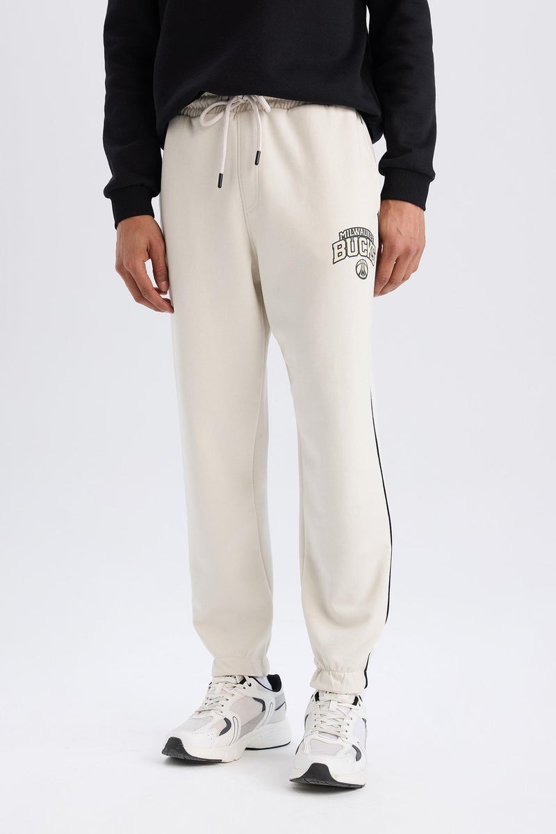 DeFacto Beige Man DeFactoFit NBA Milwaukee Bucks Standard Fit Scuba Fabric Sports Joggers Casual - Image 1