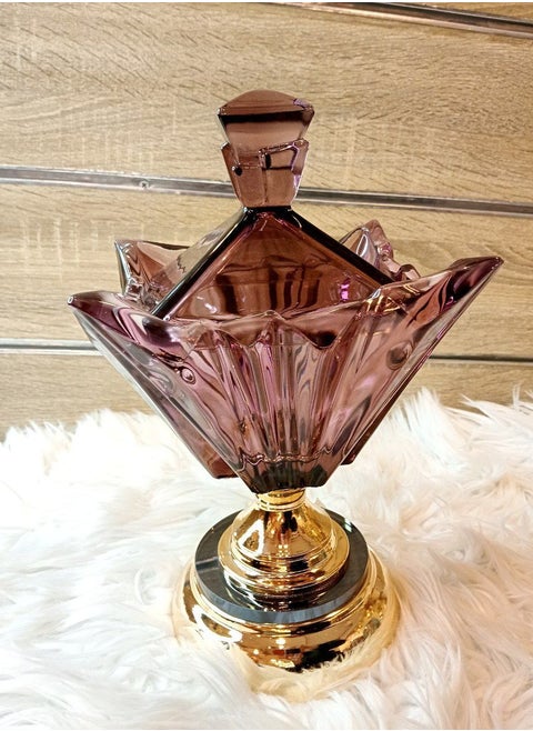 An elegant purple crystal candy dish with a faceted design the star-shaped bowl is perfect for holding a variety of treats, and the gold-plated base adds a touch of luxury.