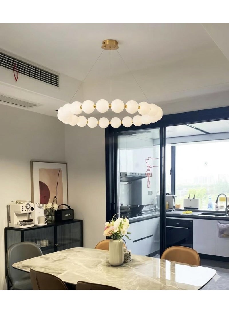 Modern circular ceiling chandelier in gold with illuminated milky glass balls. - Image 1