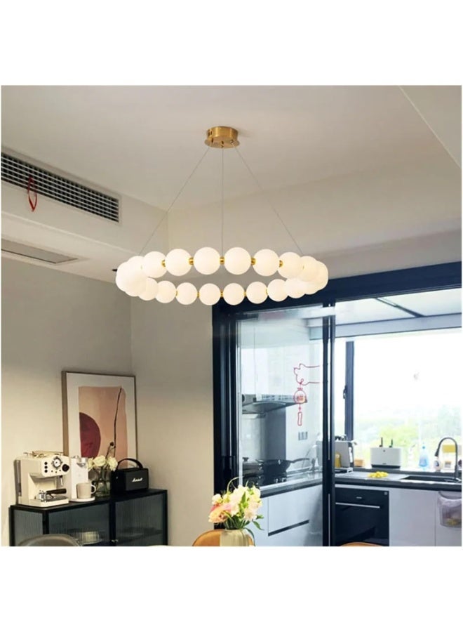 Modern circular ceiling chandelier in gold with illuminated milky glass balls. - Image 4