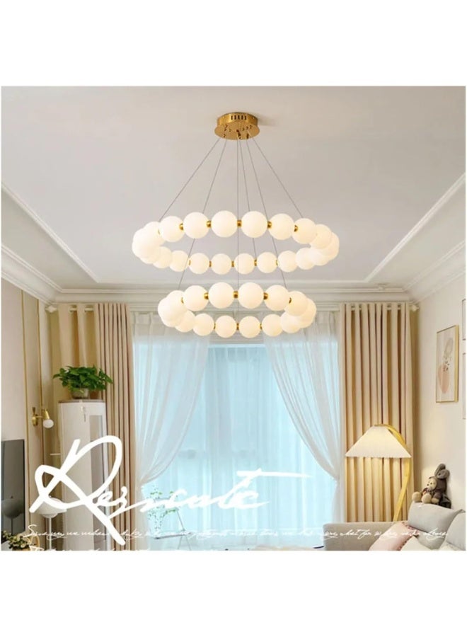 Modern circular ceiling chandelier in gold with illuminated milky glass balls. - Image 3