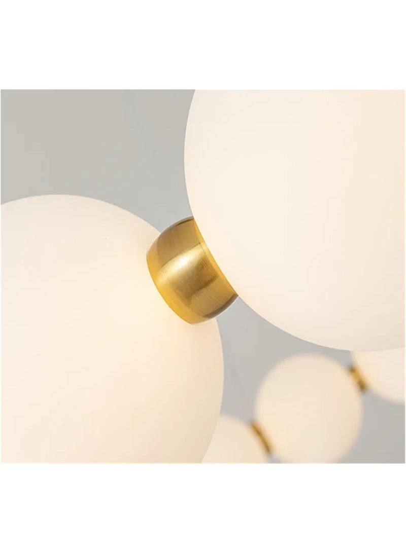 Modern circular ceiling chandelier in gold with illuminated milky glass balls. - Image 5