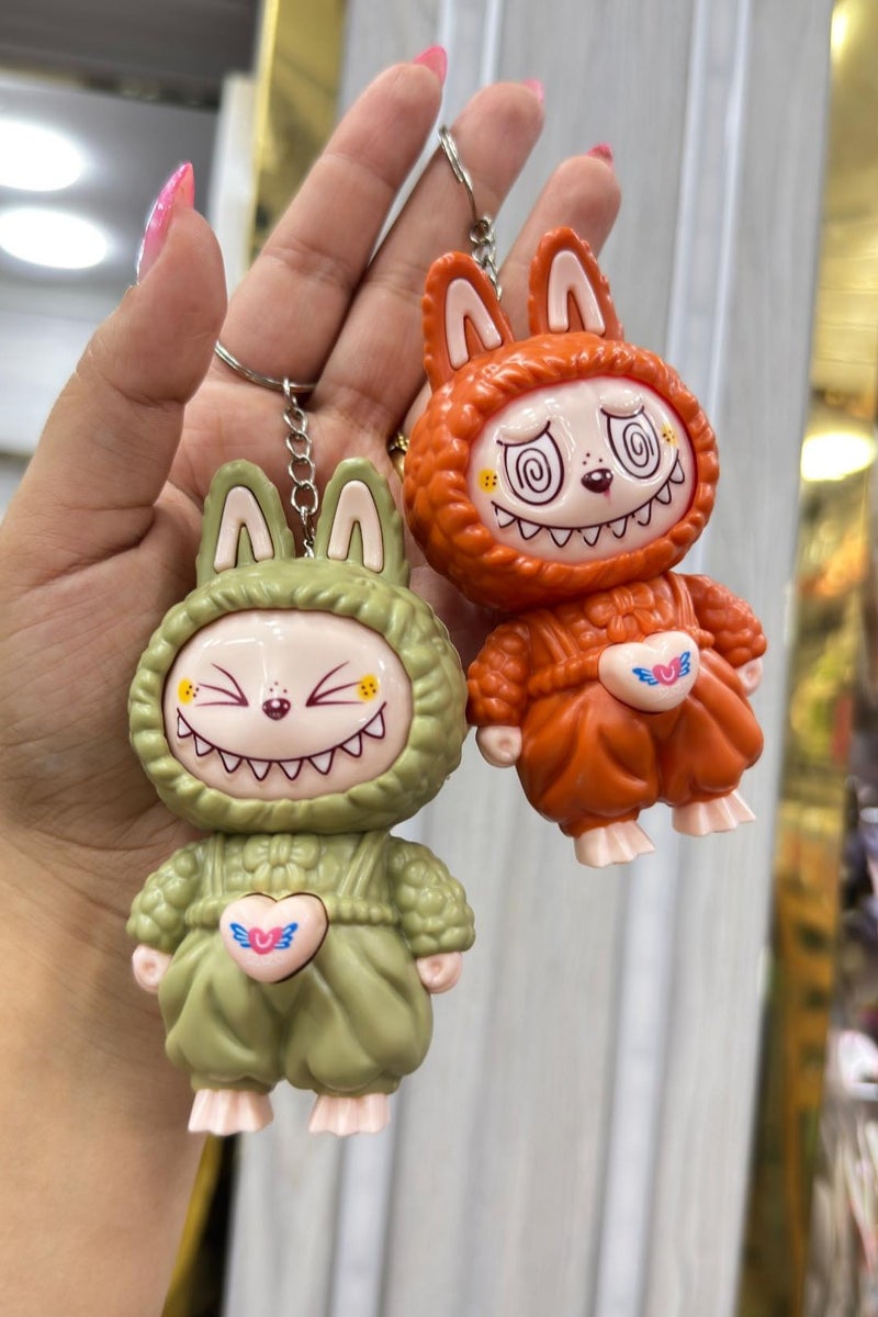 قلادة دمية لابوبو المتغيرة الوجه، هدية كرتونية أنيقة، سلسلة مفاتيح، لعبة لتخفيف التوتر للأطفال (متعددة الألوان) قطعة واحدة - Image 3