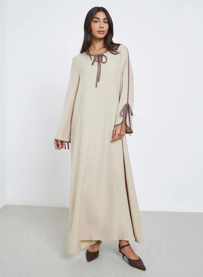 Amirah Amirah Beige Tie-Up Detail Jalabiya with Contrast Piping