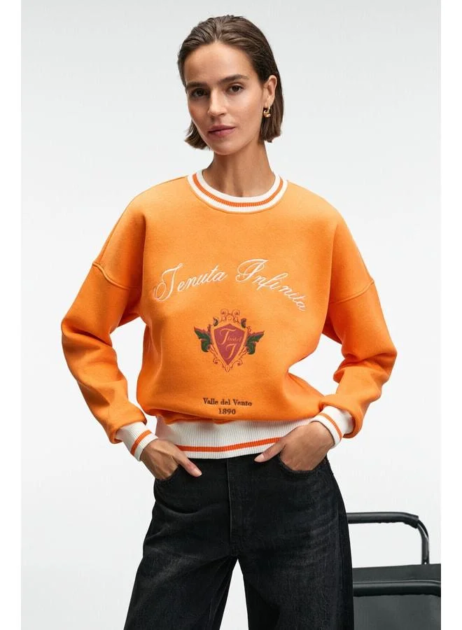 GRIMELANGE VALLUNE Women's Contrast Knit Skirt Edge Sleeve and Collar Embroidered Crop Orange Sweatshirt.