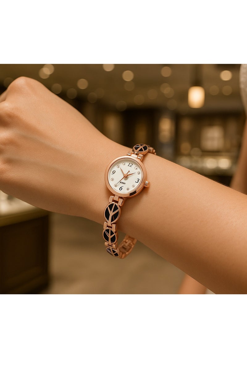 جي دبليو ساعة يد نسائية أنيقة بلون ذهبي وردي ونقوش أوراق سوداء، بتصميم فاخر وعصري - Image 2