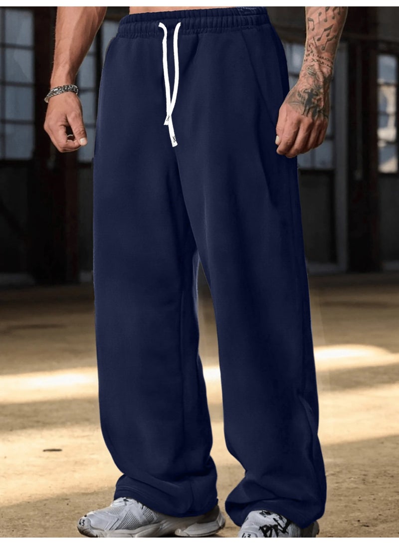 Elegant and modern men's sports pants in large sizes, color  blue. Loose and comfortable design with a drawstring, suitable for daily wear. - Image 1
