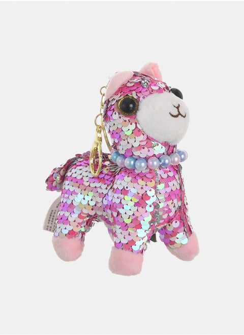 A medal in the shape of a dog with sequins