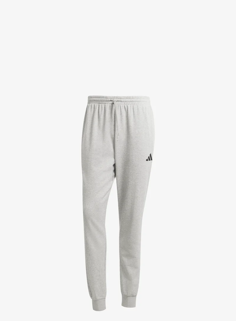 اديداس بنطال Essentials Feel Cozy من الوبر الفرنسي مريح.