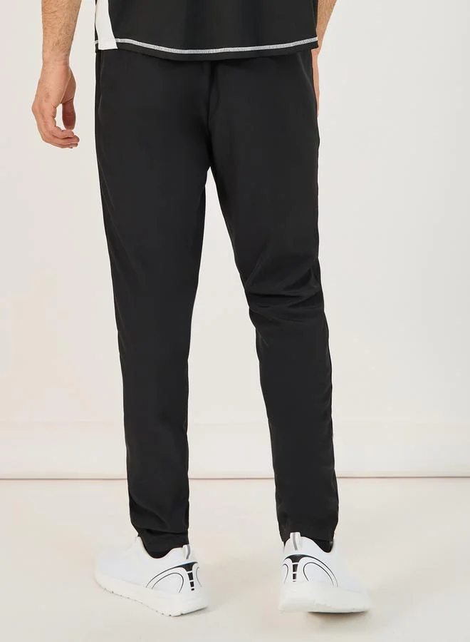Styli 4-Way Stretch Compression Knit Slim Track Pants with Piping Detail
