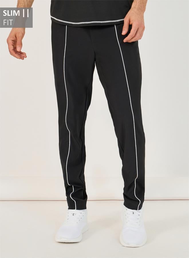 Styli 4-Way Stretch Compression Knit Slim Track Pants with Piping Detail  - Image 1