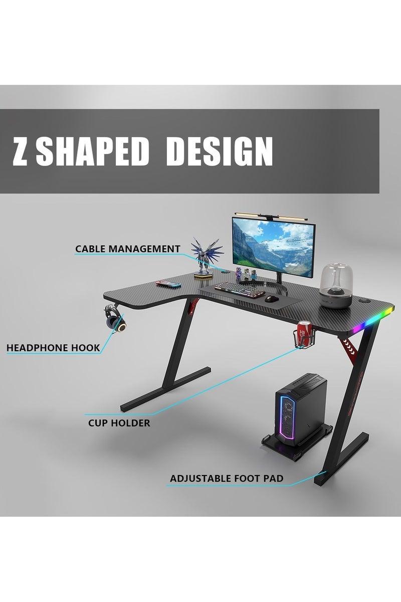 ميشيدا مكتب ألعاب على شكل L مع سطح من ألياف الكربون وإضاءة RGB – طاولة كمبيوتر زاوية 160 سم مع حامل أكواب وخطاف سماعة ولوحة فأرة – الجهة اليسرى، أسود - Image 4