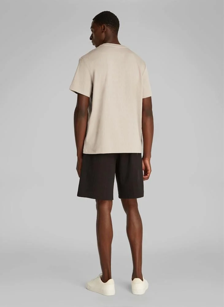 كالفن كلاين تيشيرت بياقة دائرية محبوك