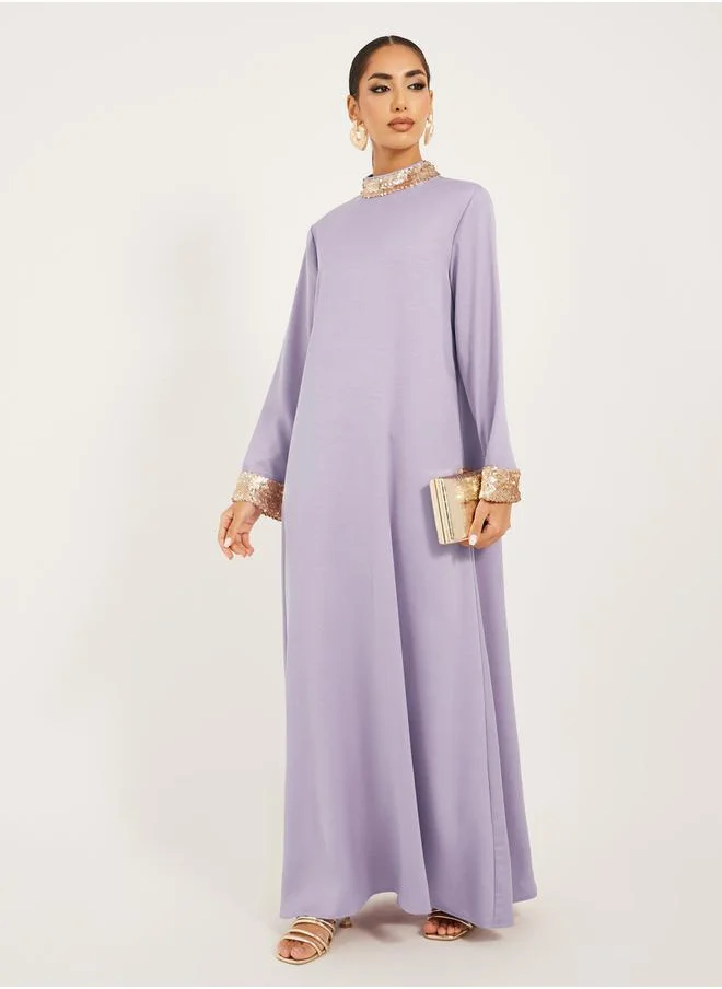 ستايلي high neck full sleeve jalabiya with shimmer trim