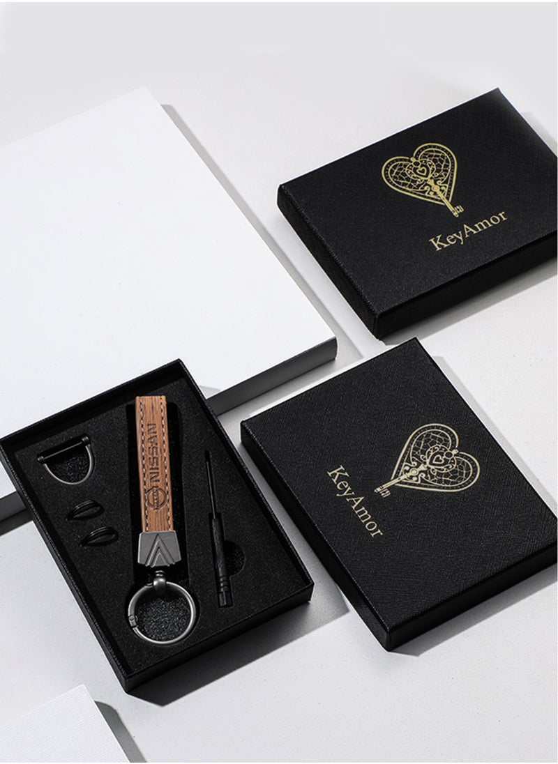 Elegant light brown metal and leather keychain with NISSAN logo featuring 3 key rings perfect as a fancy gift or car accessory designed in sleek light brown for a modern look offers 360 degree rotation for convenience suitable for both men and women and comes in a gift box.