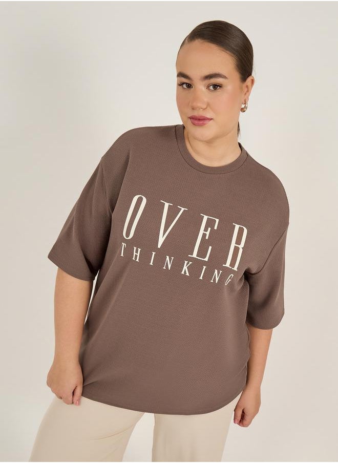 Styli Plus Size Slogan Print Dropped Shoulder Oversized T-Shirt  - Image 1