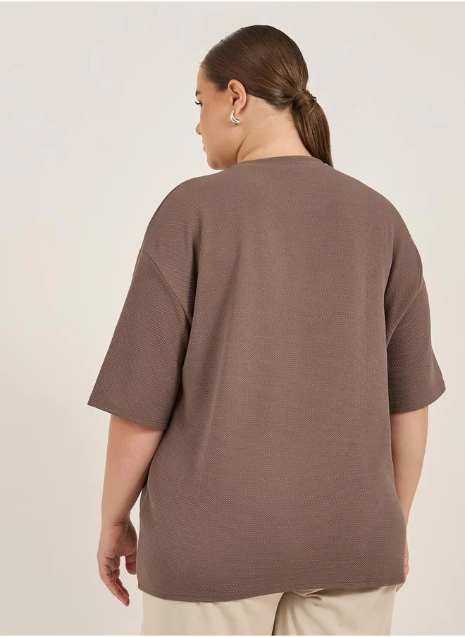 Styli Plus Size Slogan Print Dropped Shoulder Oversized T-Shirt