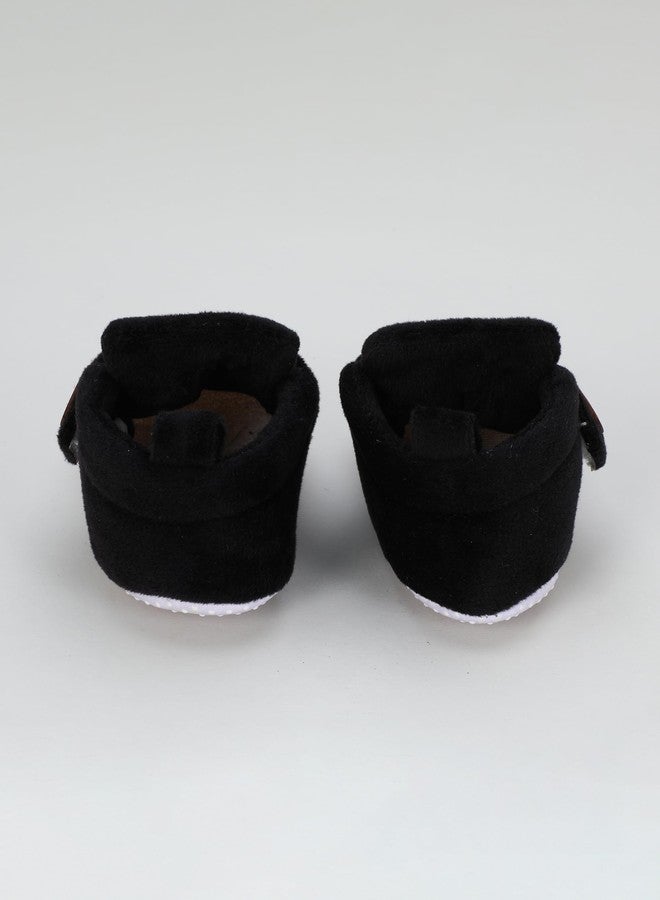 PureSole Classic & Elegant Look Baby Booties for Boys & Girls - Soft Black Velvet Crib Shoes with Wooden Button - Non-Slip Infant First Walkers (6-12 Months) PLAIN BLACK - Image 4