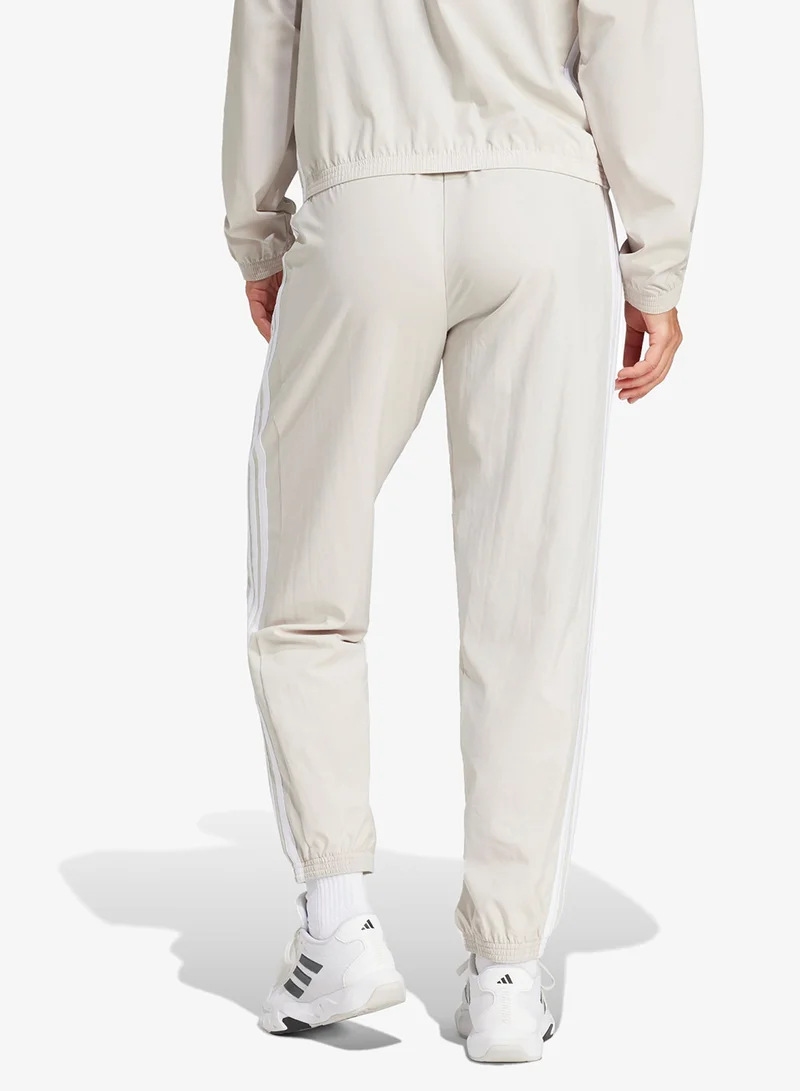 اديداس بنطلون رياضي أساسي بنسيج مخطط بثلاث خطوط