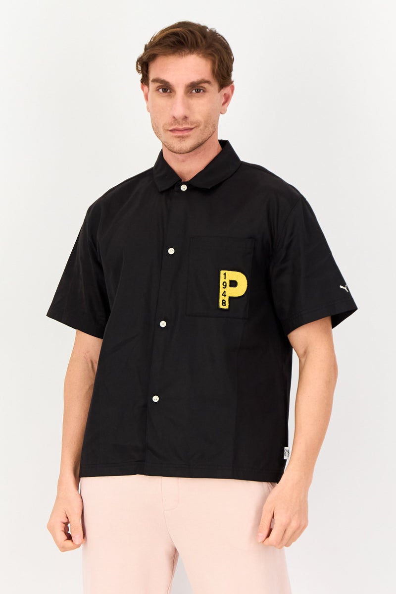 PUMA Men Sportswear Fit Embroidered Short Sleeve Outdoor Polo Shirt, Black - Image 1