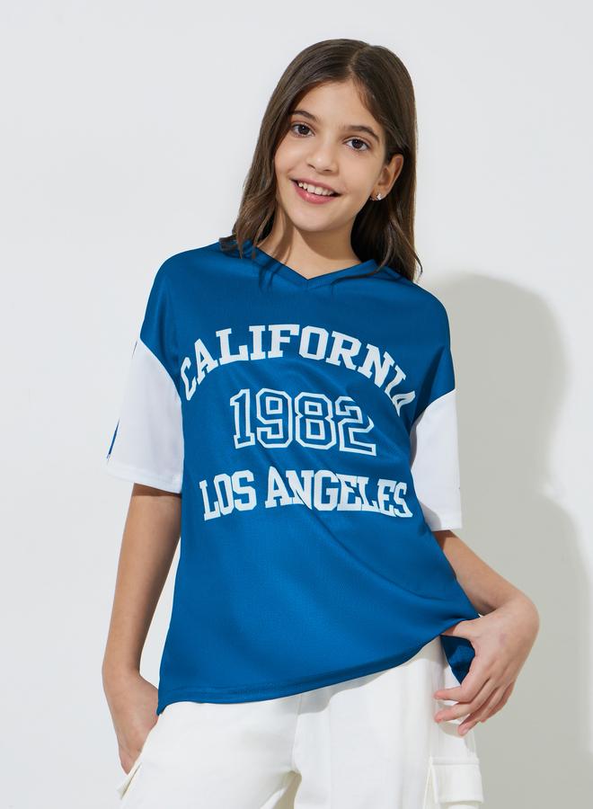 Styli Teen Girls Blue Graphic Print V-Neck Oversized T-Shirt - Image 1