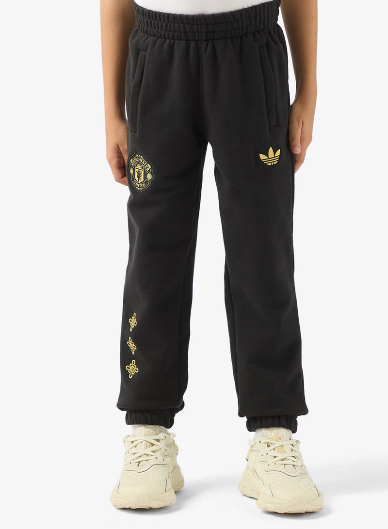 اديداس بنطلون رياضي ثقافي لمانشستر يونايتد للشباب - Image 1