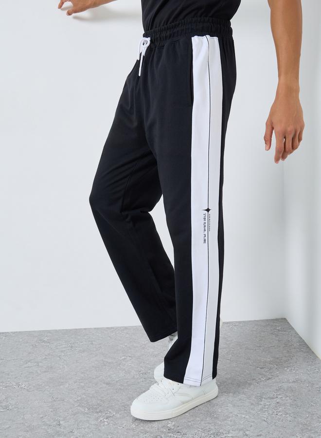 Styli Men Black Slogan Print Oversized Joggers - Image 1