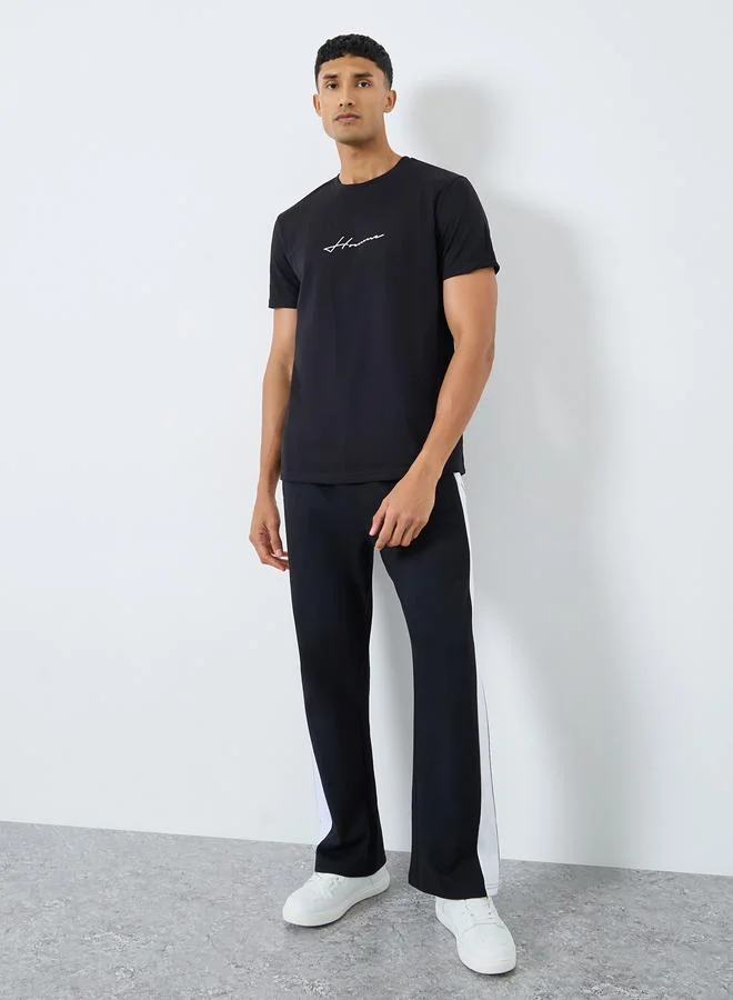 Styli Styli Men Black Slogan Print Oversized Joggers