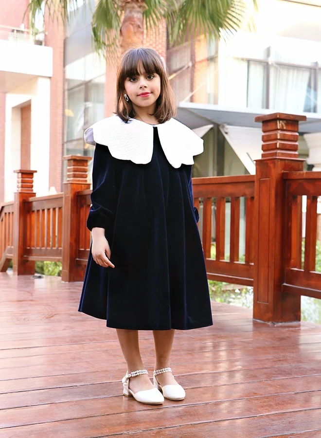 HAWRAA ABAYA Girls’ navy velvet dress with an elegant design and a luxurious white collar