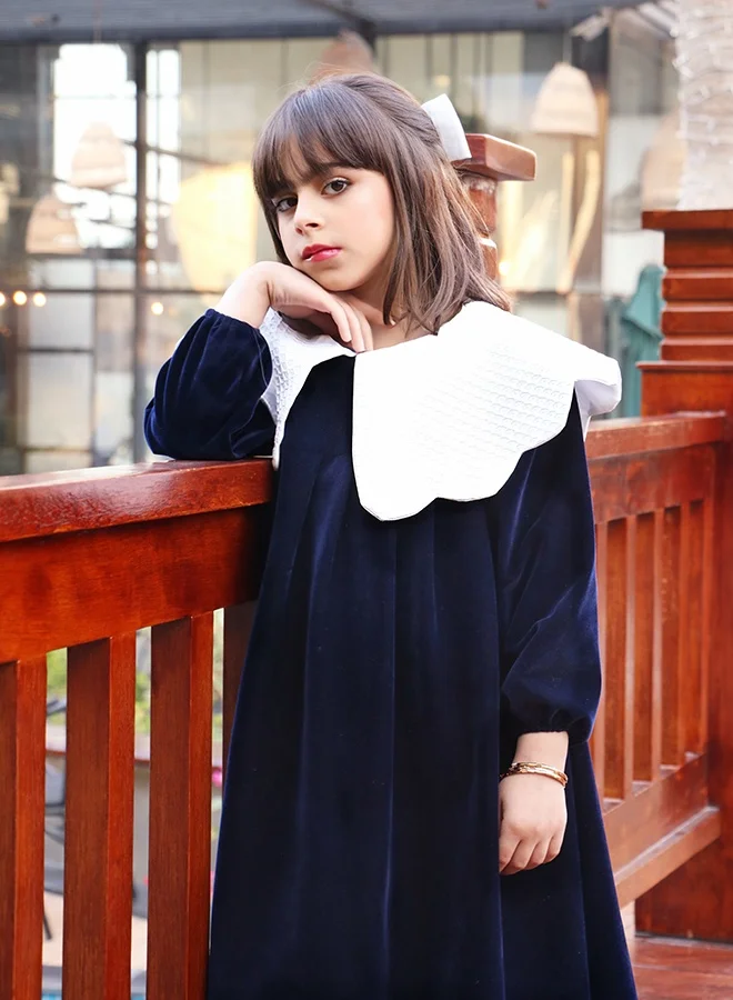 HAWRAA ABAYA Girls’ navy velvet dress with an elegant design and a luxurious white collar