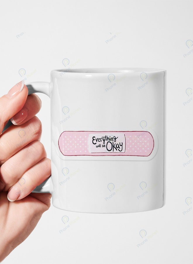A ceramic mug printed with the phrase Everything will be OK and featuring a comfortable handle