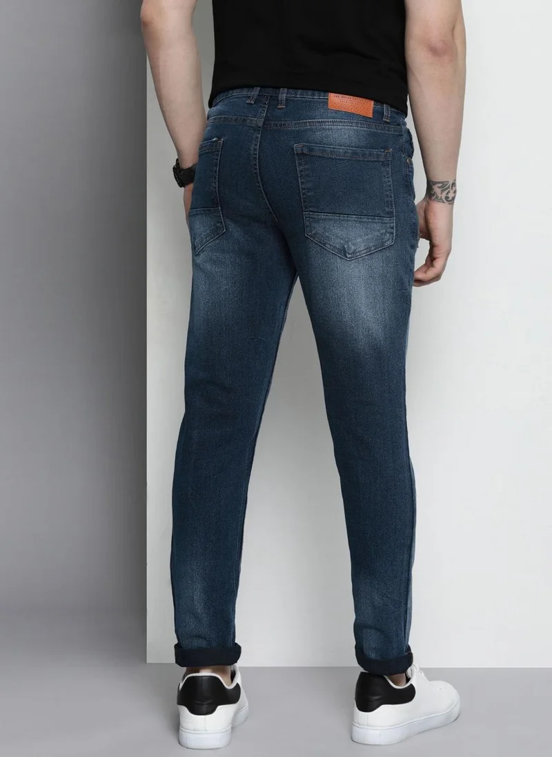 The Indian Garage Co  Men Carrot Fit Solid Mid-Rise Stretchable Jeans for Men | Best Price UAE