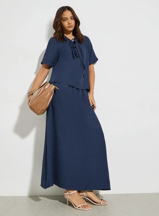 Styli Dark Blue Tie-Up Neck Blouse and Maxi Skirt Co-Ords