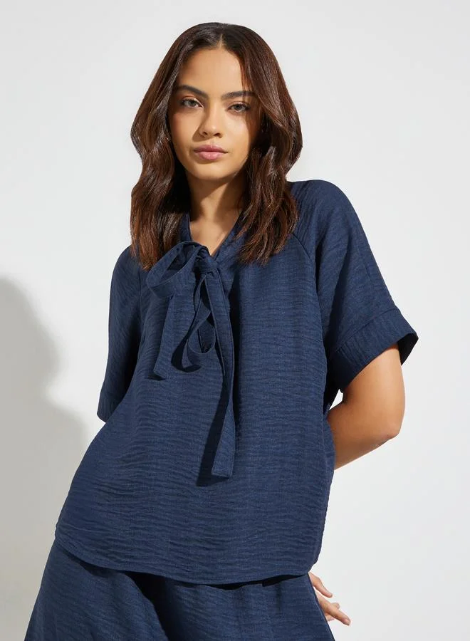 Styli Dark Blue Tie-Up Neck Blouse and Maxi Skirt Co-Ords