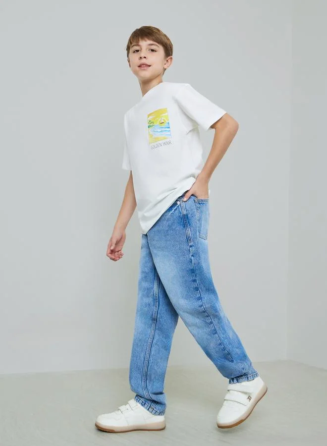 Styli Kids Graphic Print Oversized T-Shirt and Jeans Set