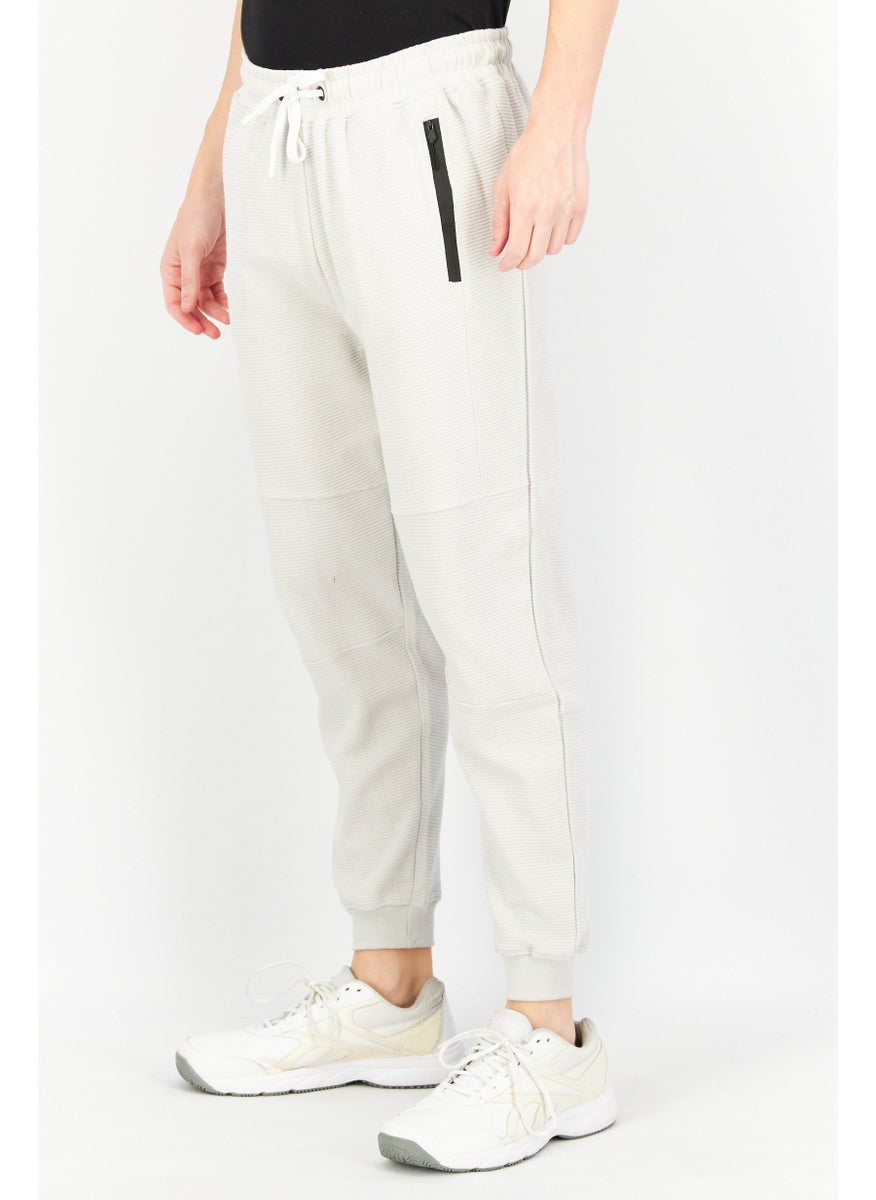 Men Regular Fit Textured Drawstring Jogger Pant, Light Grey - pzsku/ZCD6BB896EAC10464CA82Z/45/_/1726109256/72090513-b2a7-46ca-8131-3aa917d14523