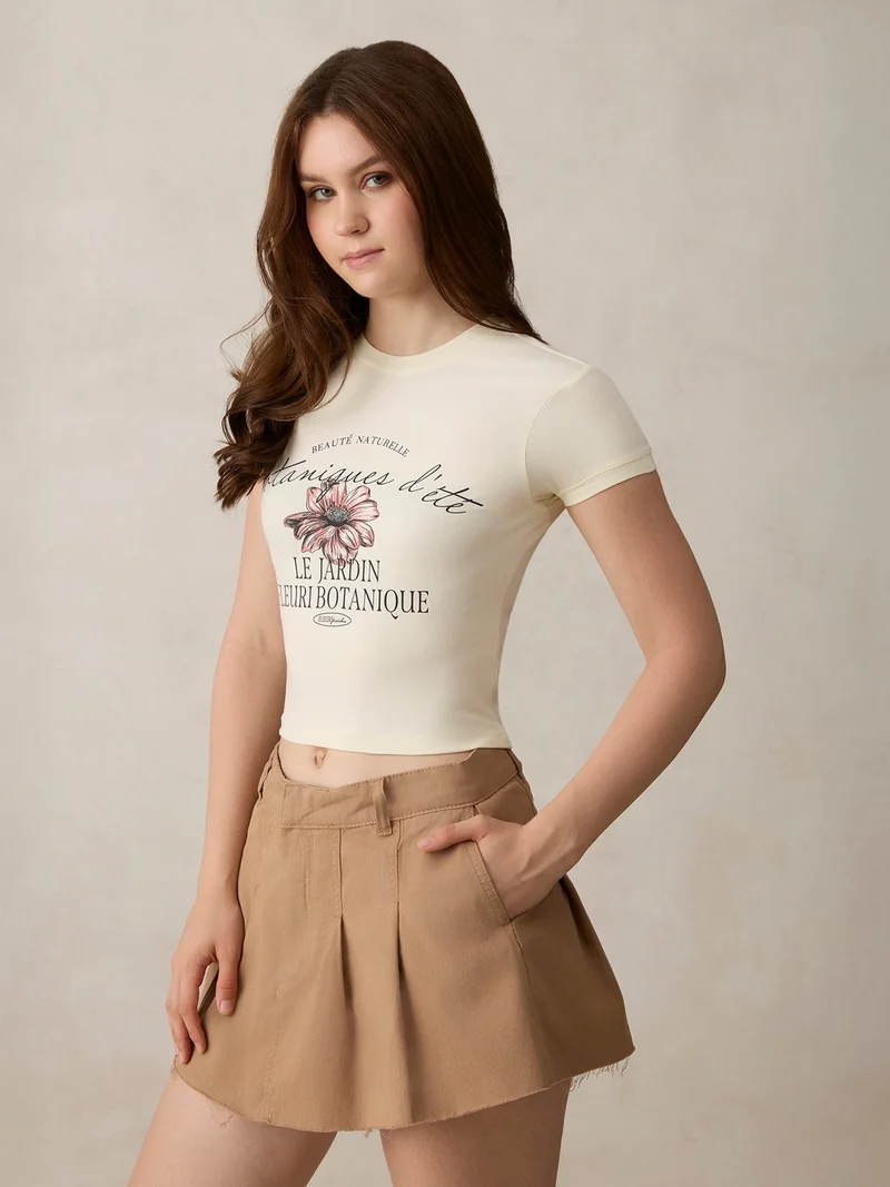 Outzidr  Off White Graphic Cropped T-Shirt for Women | Best Price UAE