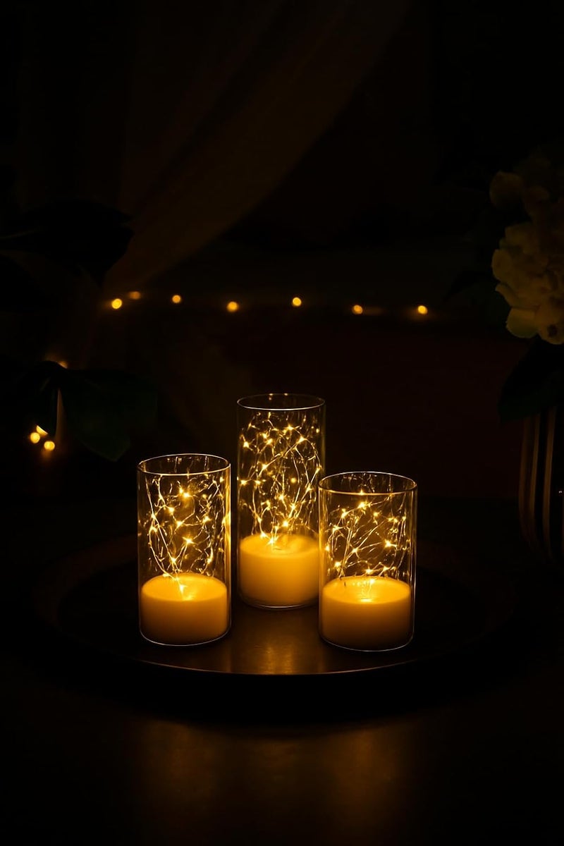 Bispy LED Flameless Candles with Warm White Fairy Lights in Glass Cylinder, Battery Operated, Realistic Flickering Effect, Decorative Lights for Bedroom, Living Room, Wedding & Home Décor (Set of 3) - Image 1