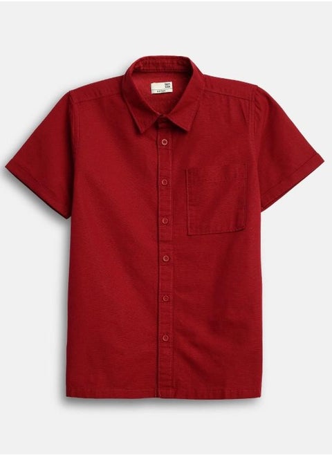 Boy's shirts in regular fit red colour cotton fabric embellished pattern pull over closure woven weave type round collar type round neckline half sleeve length button down upper body wear type suitable for casual occasions – bring home style that tells a story.
