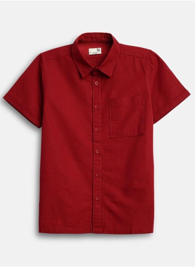 Bonkids - Boy's shirts in regular fit red colour cotton fabric embellished pattern pull over closure woven weave type round collar type round neckline half sleeve length button down upper body wear type suitable for casual occasions – bring home style that tells a story. - Image 1
