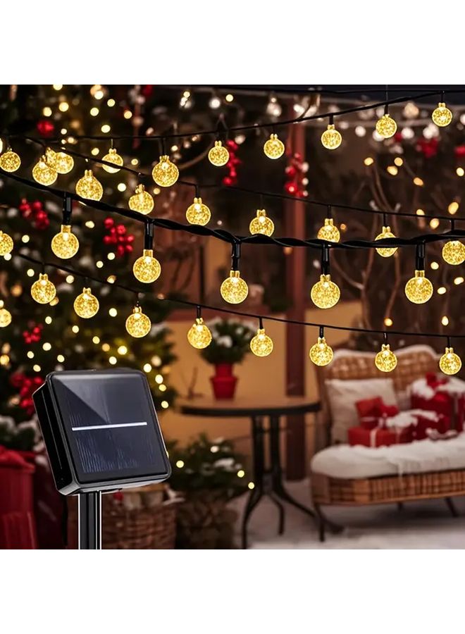 مصابيح LED شمسية معلقة على شكل كرات مضيئة، 50 لمبة، طول 7 أمتار (22.97 قدم)، مقاومة للماء بدرجة IP65، متعددة الألوان، 8 أنماط إضاءة، كرات مضيئة سحرية لتزيين الحدائق والباحات والشرفات والديكورات الخارجية، هدية للمناسبات مثل أعياد الميلاد وحفلات الهالوين والأعياد. - Image 1