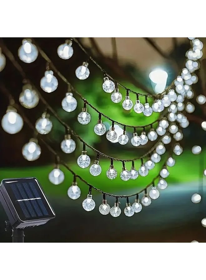 مصابيح LED شمسية معلقة على شكل كرات مضيئة، 50 لمبة، طول 7 أمتار (22.97 قدم)، مقاومة للماء بدرجة IP65، متعددة الألوان، 8 أنماط إضاءة، كرات مضيئة سحرية لتزيين الحدائق والباحات والشرفات والديكورات الخارجية، هدية للمناسبات مثل أعياد الميلاد وحفلات الهالوين والأعياد. - Image 2