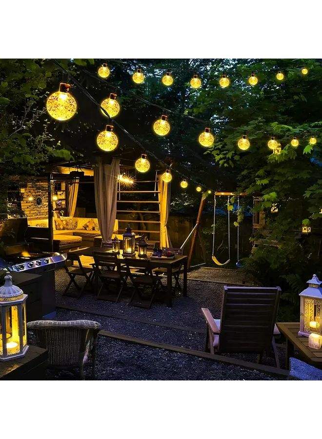 مصابيح LED شمسية معلقة على شكل كرات مضيئة، 50 لمبة، طول 7 أمتار (22.97 قدم)، مقاومة للماء بدرجة IP65، متعددة الألوان، 8 أنماط إضاءة، كرات مضيئة سحرية لتزيين الحدائق والباحات والشرفات والديكورات الخارجية، هدية للمناسبات مثل أعياد الميلاد وحفلات الهالوين والأعياد. - Image 5